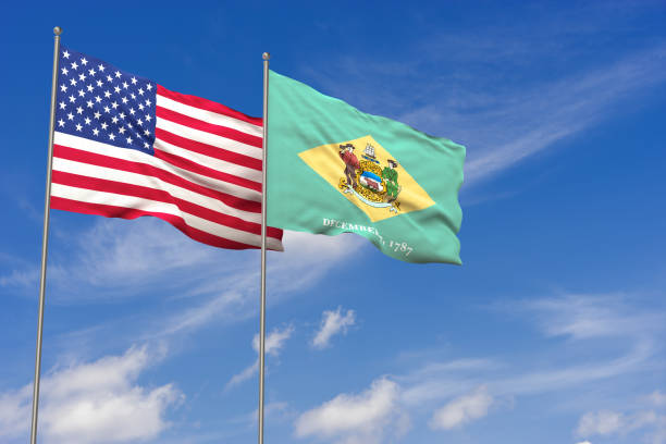 USA and Delaware flags over blue sky background. 3D illustration stock photo