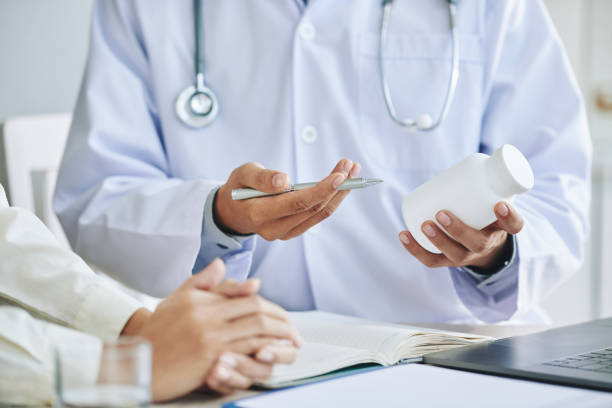 istock Crop doctor prescribing pills to patient 986711654