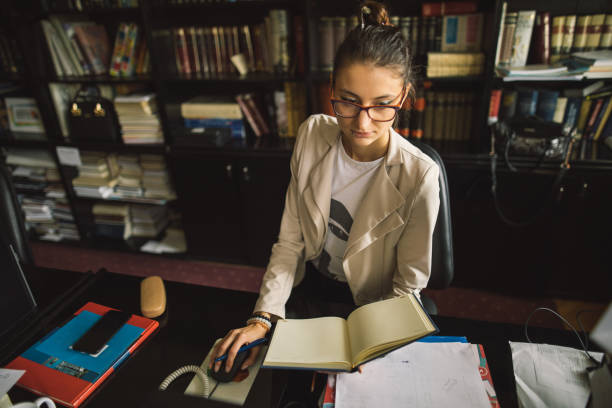 istock Young secretary focused on her job 986715652