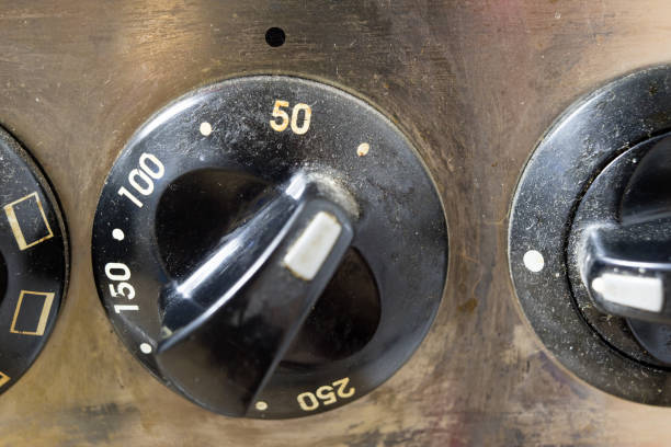 istock An old dirty gas kitchen. Device for preparing dishes in the kitchen. Dark background. 986715752