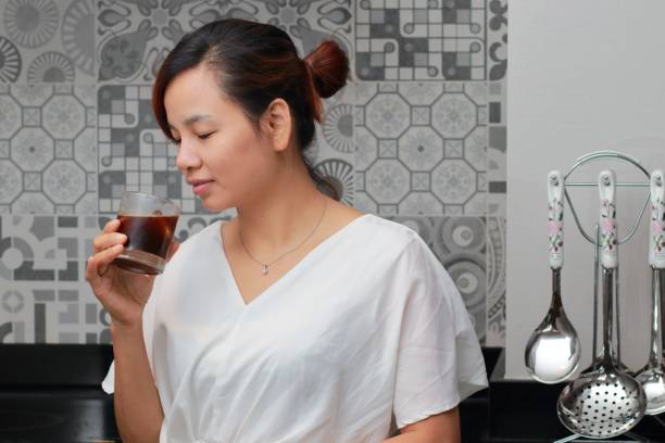 istock a woman thinking about dinner menu in the kitchen 986715880