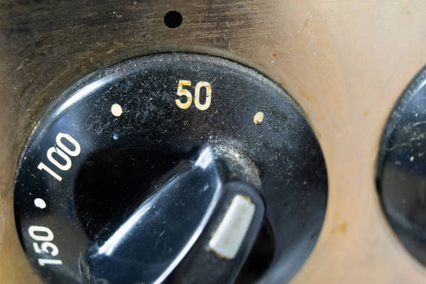 istock An old dirty gas kitchen. Device for preparing dishes in the kitchen. Dark background. 986716504