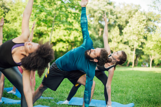 istock Young fit people stretching at the park 986726650