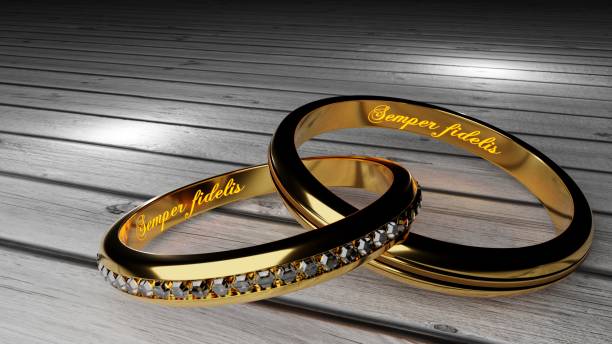 semper fidelis, which means 'always loyal' - warm, glowing words inside two tied golden rings to symbolize eternal love and marriage bond, 3d illustration - semper fidelis imagens e fotografias de stock