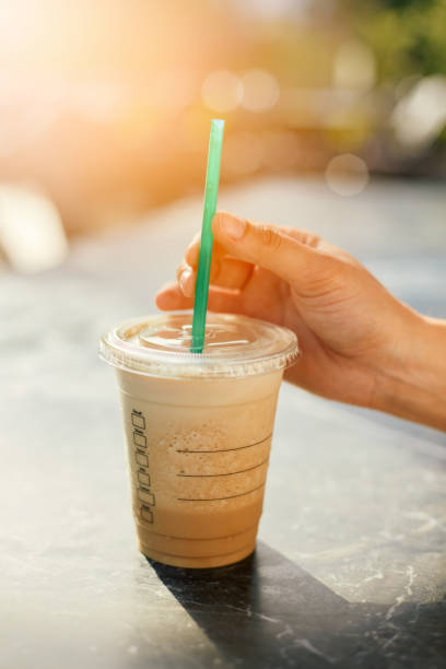 istock Woman Drinking Iced Coffee 986737268
