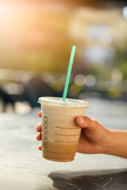 istock Woman Drinking Iced Coffee 986737272