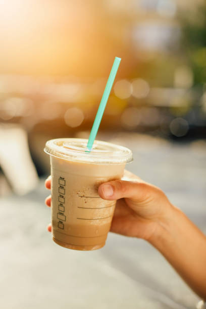 istock Woman Drinking Iced Coffee 986737354