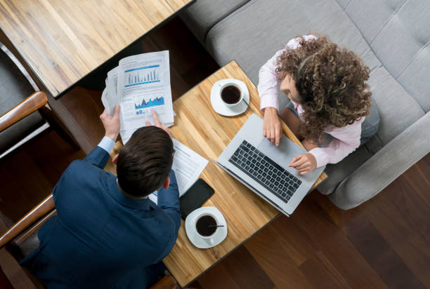 istock Business couple working online at a cafe 986740846