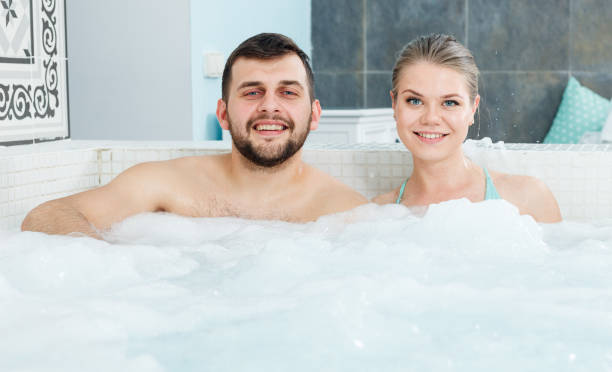 istock Couple relaxing in hot tub 986741748