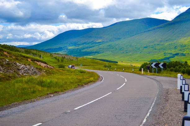 istock Road through Highlands, in Scotland (United Kingdom) 986744604