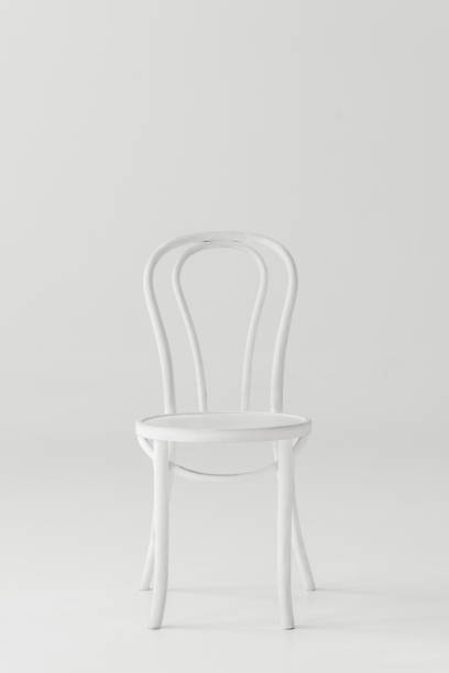 istock front view of white chair isolated on grey background 986745632