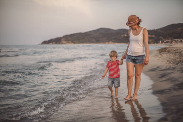 istock Mother and son at the beach 986745752