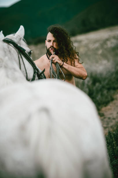 istock Male Trainer Lecturing His Horse And Training His Movement 986745968