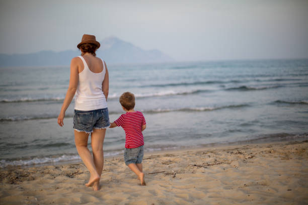 istock Mother and son at the beach 986746122