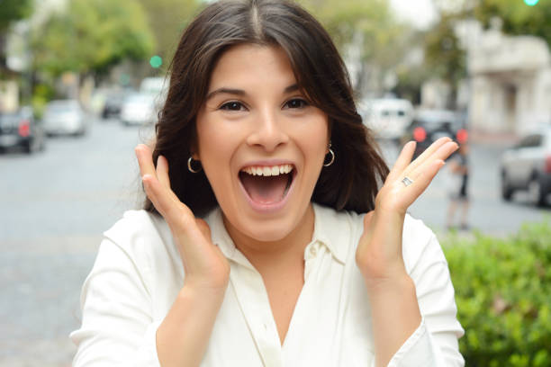 istock Young woman with surprised expression. Outdoor. 986752676