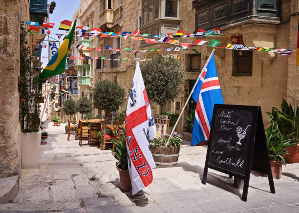 VALLETTA, MALTA - JUNE 24, 2018: Advertising banner in front of sports pub inviting to watch live football translations in heart of the Valletta