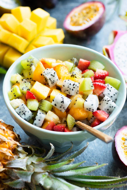 istock Fruit salad bowl with tropical fruits 986754834