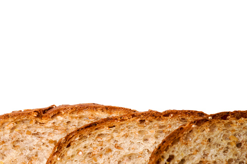 Healthy whole skiced wheat bread on white background