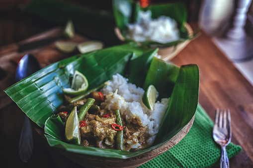 Indonesian Chicken Curry Dish with Rice Served on Banana Leaf