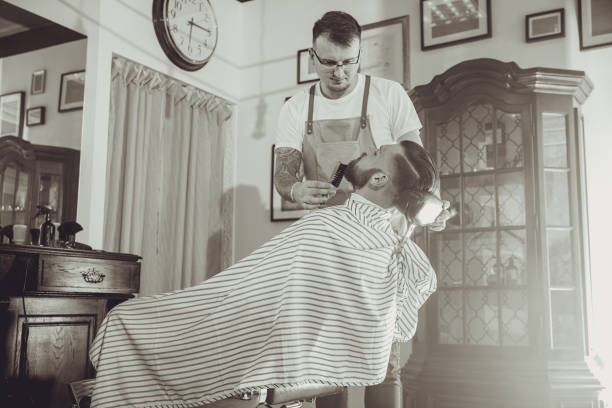 istock Barber during work in his barber shop 986799664