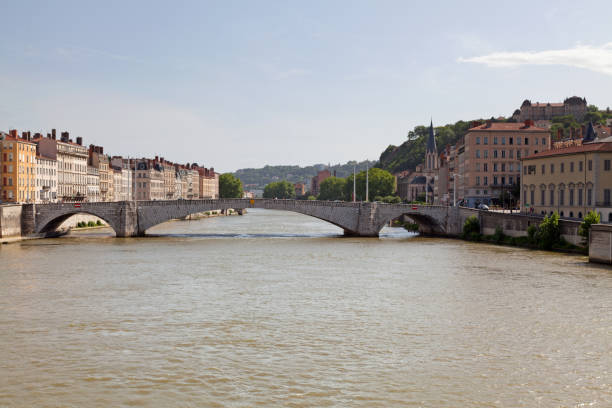 The Pont Bonaparte crossing the Saône river, with behind on the right side, the Église Saint Georges with atop the hill, the Lycée Saint Just.