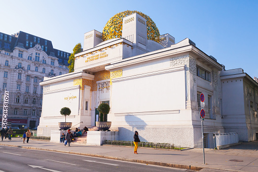 Vienna, Austria - November 4, 2015: The Vienna Secession building, built in 1897 by Joseph Maria Olbrich. Ordinary people walk on street