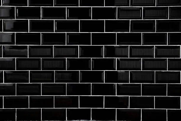 Photo of Black ceramic tiles, Wallpaper and background concept.