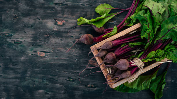istock Fresh beets in Wooden Box. On a wooden background. Top view. Copy space. 986821680