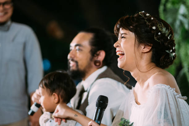 istock Wedding couple lovingly look at each other during ceremony 986830420