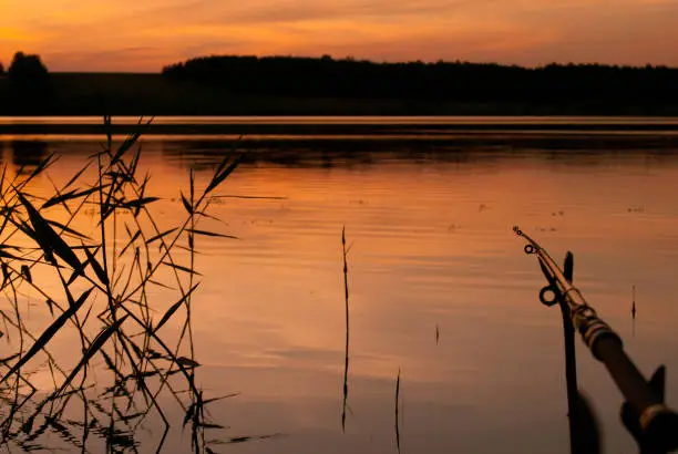 Fishing on the lake at sunset. Pravdinskoe Reservoir, Altai Territory, Russia