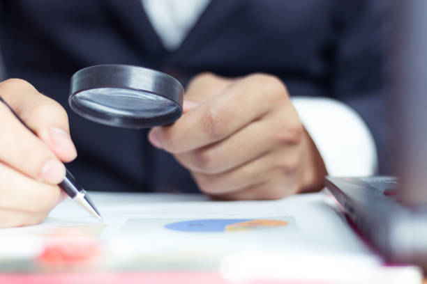 istock Businessmen use a magnifying glass to analyze the company's data and statistics from the chart. 986860702