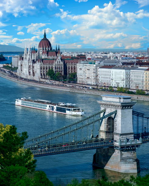 Budapest River View Cruise ship on the Danube River with a view of the Hungarian Parliament Building - Budapest, Hungary danube river stock pictures, royalty-free photos & images