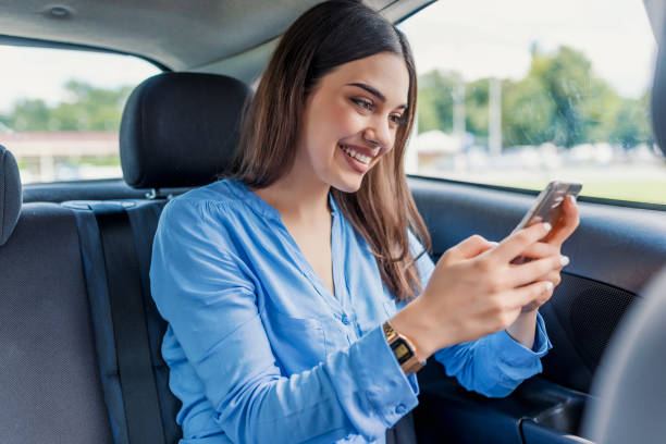 istock Woman using digital map on cellphone for planning guide route during road trip 986867350
