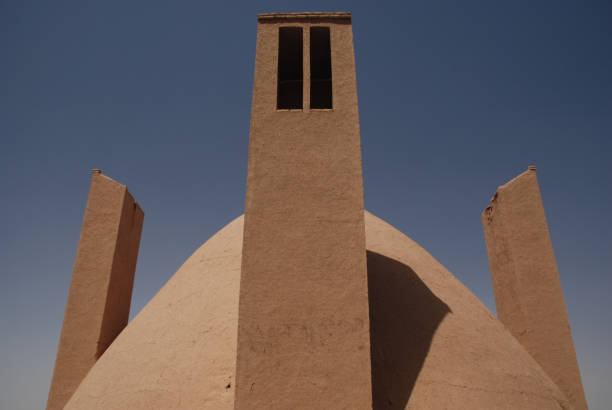 istock Traditional water cistern featuring four wind towers from Meybod, Iran 986878744