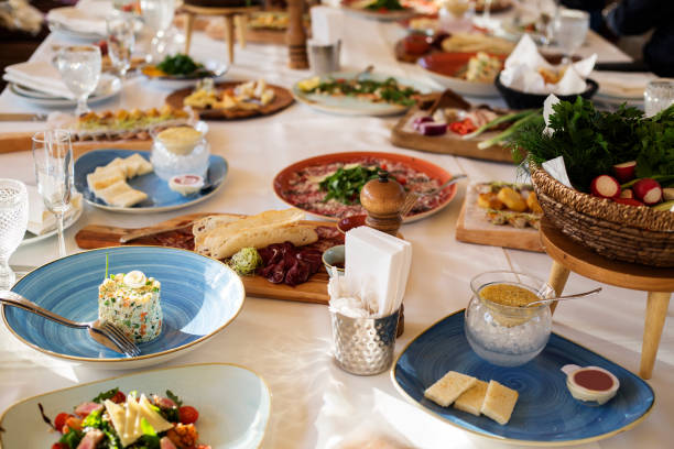 istock Table served with food and flatware. Banquet table for guests. 986900688