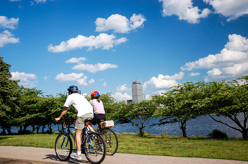 People riding bike along Charles river. May 2009. Boston - USA.