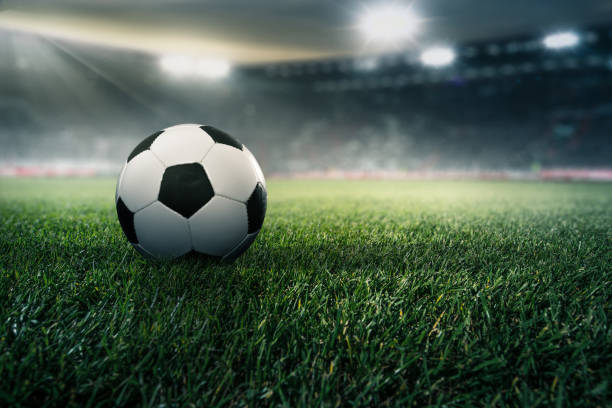 istock Football in a stadium 986933680