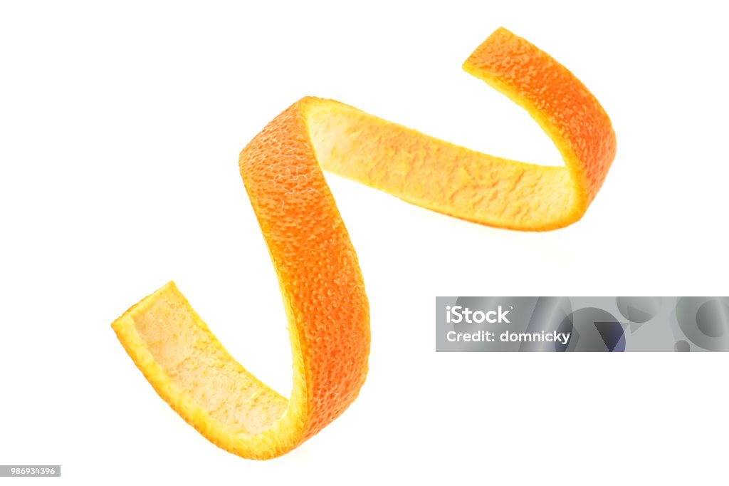 Orange zest spiral over white background. Healthy food. Peel - Plant Part Stock Photo