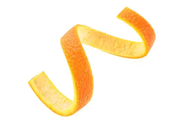 Orange zest spiral over white background. Healthy food.