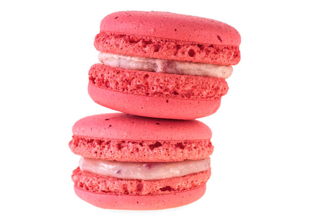 istock Two red macaroon isolated on white background, closeup. 986934488
