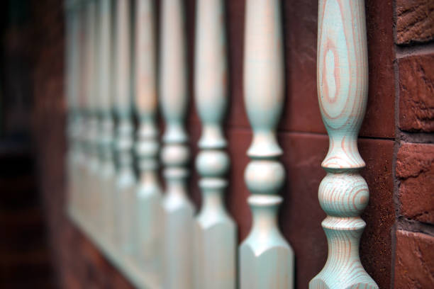 Wooden railings against the backdrop of red brick wall