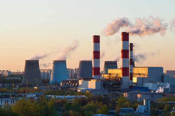 istock Smoking power plant pipes 986939734
