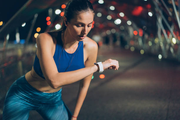 istock Sportswoman checking her smart watch 986958638
