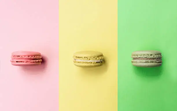 Photo of Colorful macarons with same color background