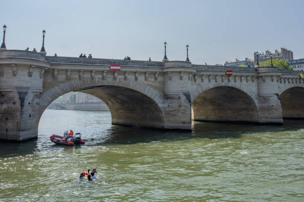 Paris / France - May 19, 2018: Security rescue workers practice a water rescue in the Seine River.