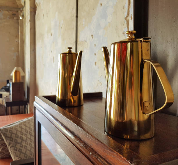 istock Two golg metal teapot in interior 986999848