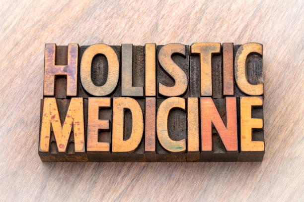 istock holistic medicine - word abstract in wood type 987009844
