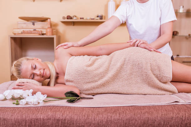 istock Woman having massage in the spa salon 987013556