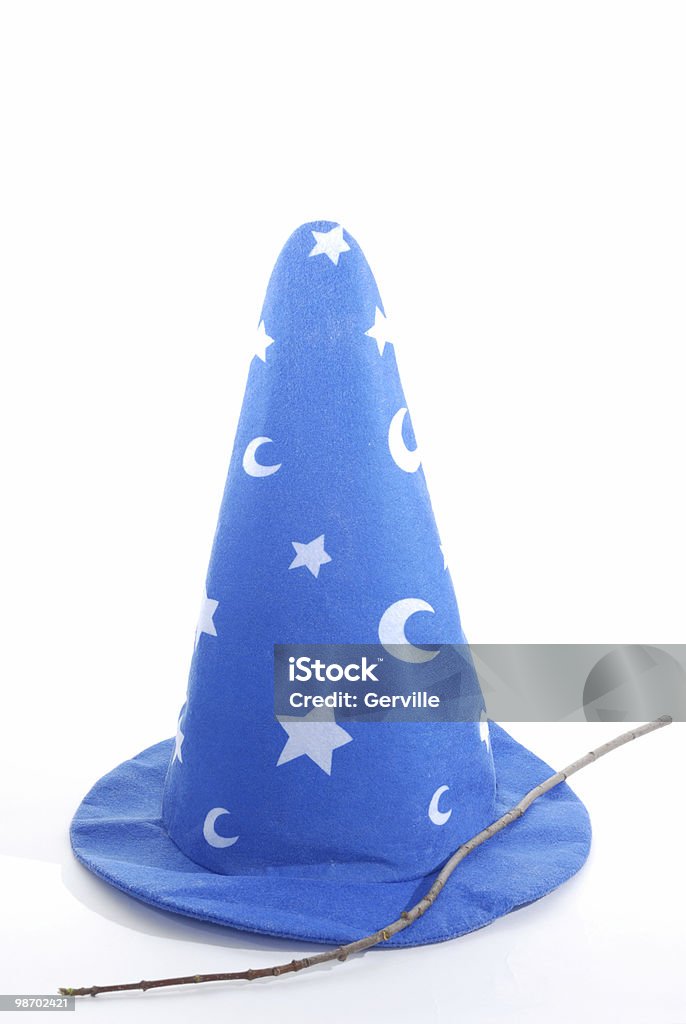 Wizard's magical hat and tree branch wand A Wizzard's hat and wand. Wizard Stock Photo