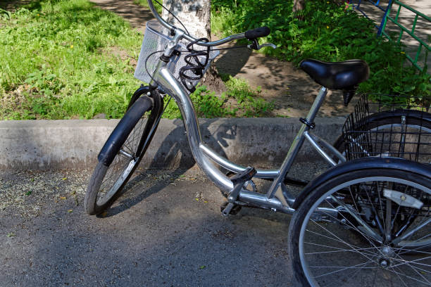 istock metallic and black adult tricycle. 987025124